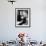 Young Woman Sitting N a Bench in Front of a Jail Cell-null-Framed Photo displayed on a wall