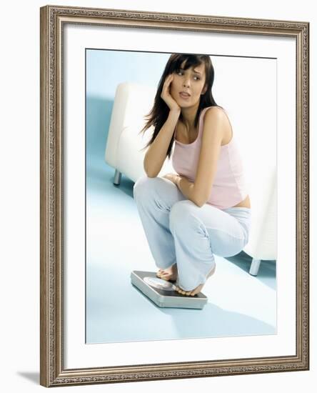 Young Woman, Squatting on Scales, Chin in Hand-null-Framed Photographic Print
