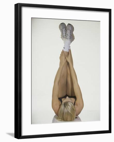 Young Woman Stretching-null-Framed Photographic Print