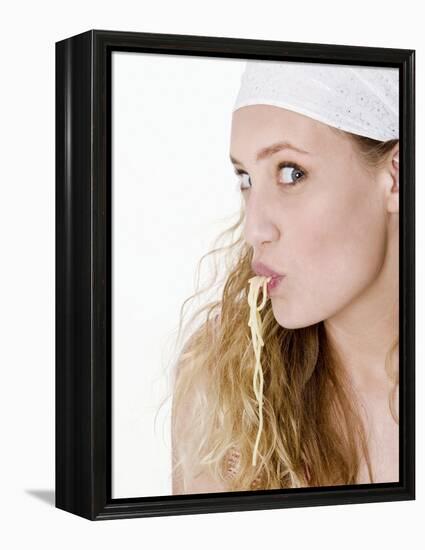 Young Woman Sucking Spaghetti-null-Framed Premier Image Canvas