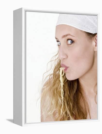Young Woman Sucking Spaghetti-null-Framed Premier Image Canvas