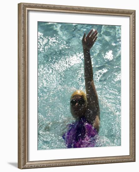 Young Woman Swimming the Backstroke in a Swimming Pool, Bainbridge Island, Washington, USA-null-Framed Photographic Print