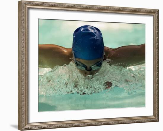 Young Woman Swimming the Butterfly Stroke in a Swimming Pool, Bainbridge Island, Washington, USA-null-Framed Photographic Print