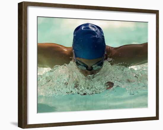 Young Woman Swimming the Butterfly Stroke in a Swimming Pool, Bainbridge Island, Washington, USA-null-Framed Photographic Print