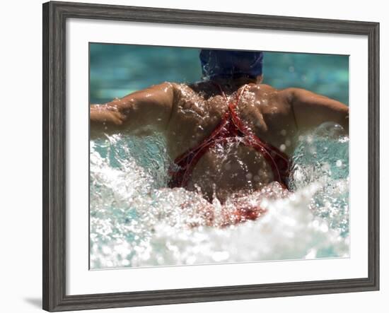 Young Woman Swimming the Butterfly Stroke in a Swimming Pool, Bainbridge Island, Washington, USA-null-Framed Photographic Print