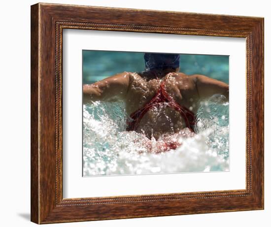 Young Woman Swimming the Butterfly Stroke in a Swimming Pool, Bainbridge Island, Washington, USA-null-Framed Photographic Print