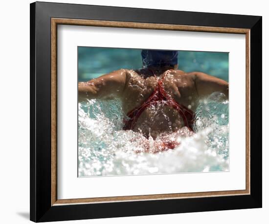 Young Woman Swimming the Butterfly Stroke in a Swimming Pool, Bainbridge Island, Washington, USA-null-Framed Photographic Print