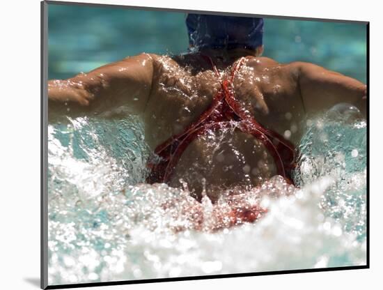 Young Woman Swimming the Butterfly Stroke in a Swimming Pool, Bainbridge Island, Washington, USA-null-Mounted Photographic Print