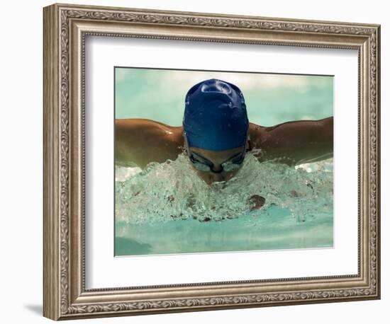 Young Woman Swimming the Butterfly Stroke in a Swimming Pool, Bainbridge Island, Washington, USA-null-Framed Photographic Print