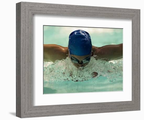 Young Woman Swimming the Butterfly Stroke in a Swimming Pool, Bainbridge Island, Washington, USA-null-Framed Photographic Print