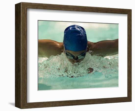 Young Woman Swimming the Butterfly Stroke in a Swimming Pool, Bainbridge Island, Washington, USA-null-Framed Photographic Print