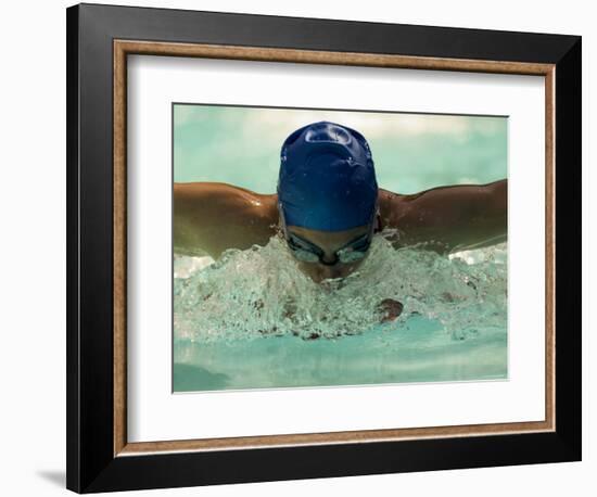 Young Woman Swimming the Butterfly Stroke in a Swimming Pool, Bainbridge Island, Washington, USA-null-Framed Photographic Print