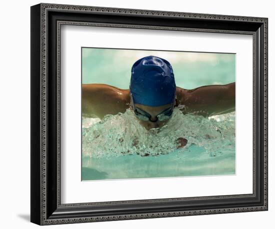 Young Woman Swimming the Butterfly Stroke in a Swimming Pool, Bainbridge Island, Washington, USA-null-Framed Photographic Print