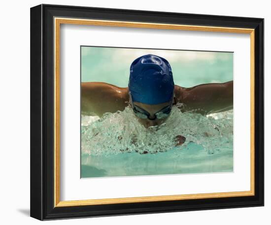 Young Woman Swimming the Butterfly Stroke in a Swimming Pool, Bainbridge Island, Washington, USA-null-Framed Photographic Print