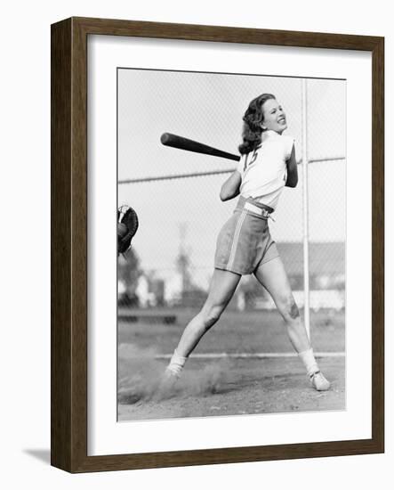 Young Woman Swinging a Baseball Bat in a Baseball Field-Everett Collection-Framed Photographic Print