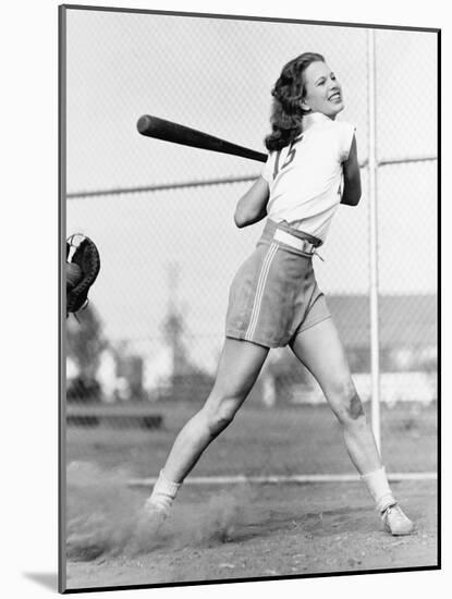 Young Woman Swinging a Baseball Bat in a Baseball Field-Everett Collection-Mounted Photographic Print