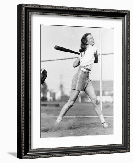 Young Woman Swinging a Baseball Bat in a Baseball Field-Everett Collection-Framed Photographic Print