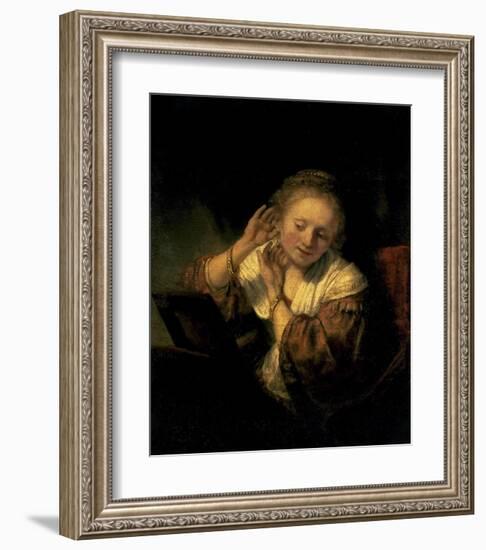 Young Woman Trying Earrings, 1654-Rembrandt van Rijn-Framed Art Print