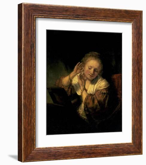 Young Woman Trying Earrings, 1654-Rembrandt van Rijn-Framed Art Print