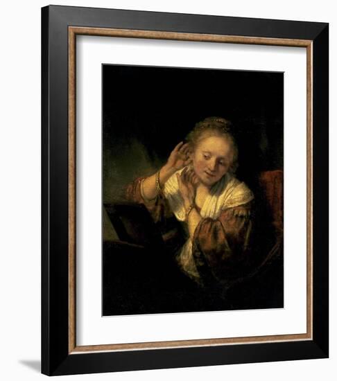 Young Woman Trying Earrings, 1654-Rembrandt van Rijn-Framed Art Print