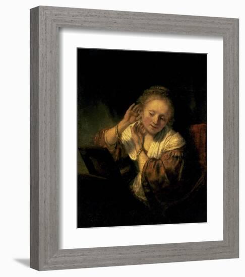 Young Woman Trying Earrings, 1654-Rembrandt van Rijn-Framed Art Print