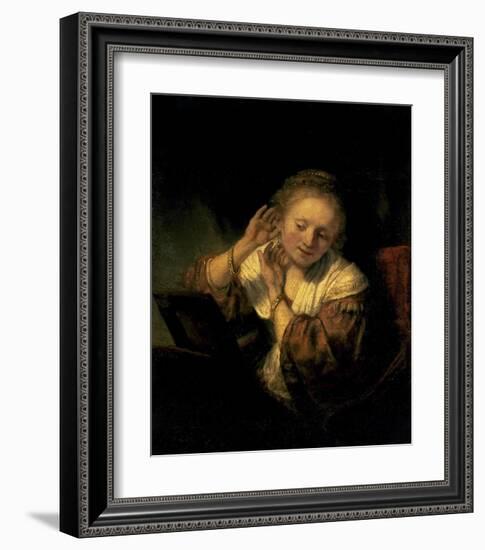 Young Woman Trying Earrings, 1654-Rembrandt van Rijn-Framed Art Print