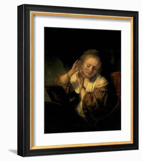 Young Woman Trying Earrings, 1654-Rembrandt van Rijn-Framed Art Print