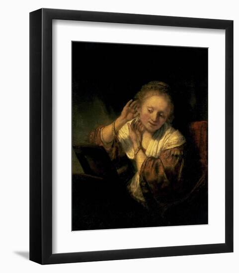 Young Woman Trying Earrings, 1654-Rembrandt van Rijn-Framed Art Print