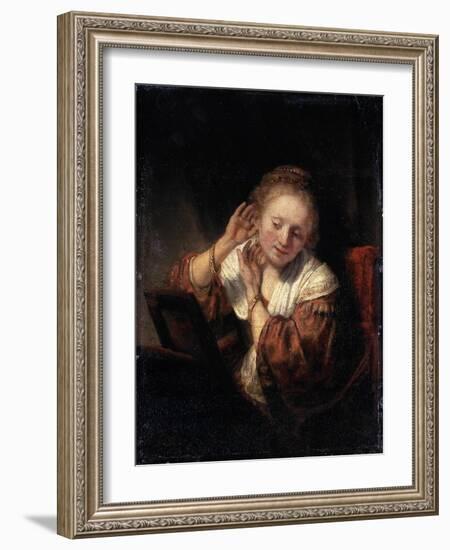 Young Woman Trying on Earrings, 1657-Rembrandt van Rijn-Framed Giclee Print