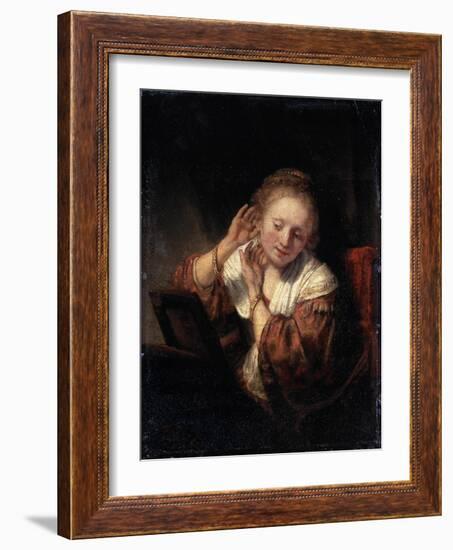 Young Woman Trying on Earrings, 1657-Rembrandt van Rijn-Framed Giclee Print