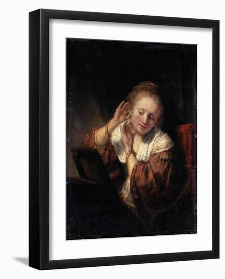 Young Woman Trying on Earrings, 1657-Rembrandt van Rijn-Framed Giclee Print