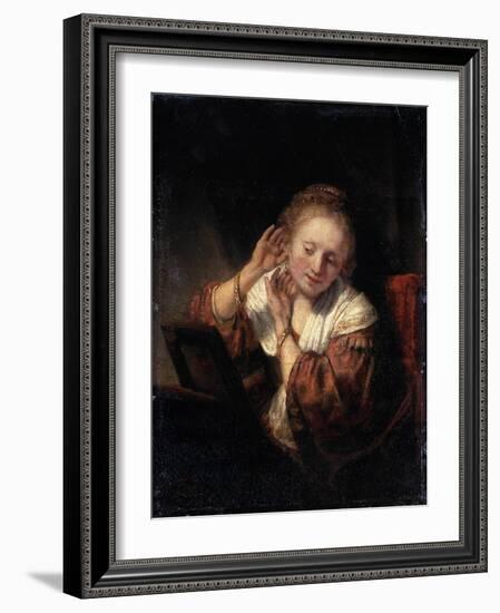 Young Woman Trying on Earrings, 1657-Rembrandt van Rijn-Framed Giclee Print