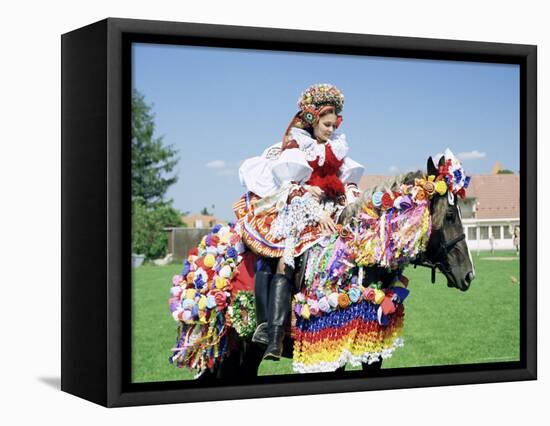 Young Woman Wearing Folk Dress on Horseback, Ride of the Kings Festival, Village of Vlcnov, Vlcnov-Richard Nebesky-Framed Premier Image Canvas