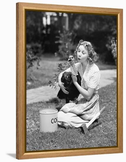 Young Woman, with an Ax Next to Her, Hugs a Turkey-null-Framed Stretched Canvas