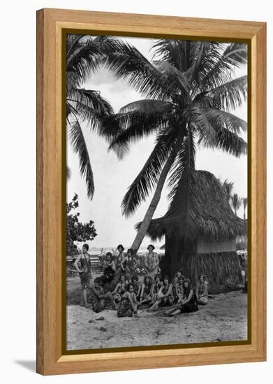 Young Women in Polynesian-Flapper Costumes Lounge under a Coconut Palm-null-Framed Premier Image Canvas