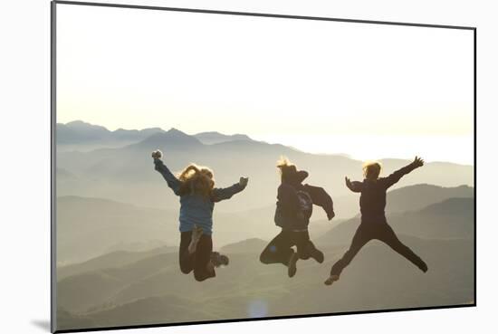 Young Women Jumping On Top Of Mountain. Saddle Mountain State Park, OR-Justin Bailie-Mounted Photographic Print