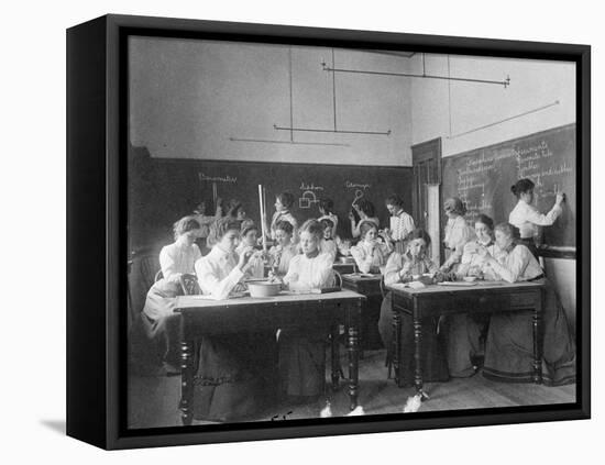 Young women performing atmospheric pressure experiments in normal school, Washington D.C., c.1899-Frances Benjamin Johnston-Framed Premier Image Canvas