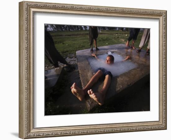 Youth Swims in a Water Reservoir as the Temperature Rises, on the Outskirts of Islamabad, Pakistan-null-Framed Photographic Print