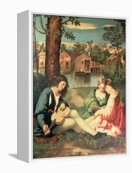 Youth with a Guitar and Two Girls Sitting on a River Bank-Giorgione-Framed Premier Image Canvas