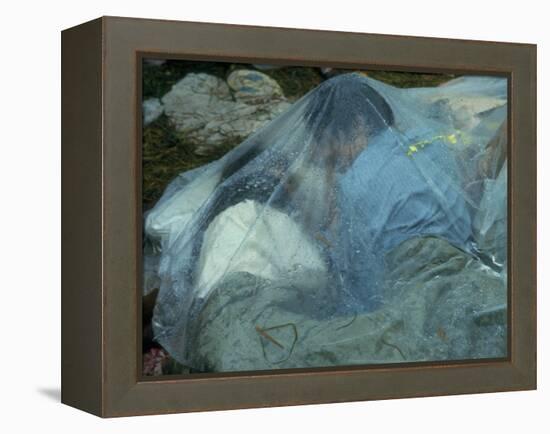 Youths Huddled under a Piece of Clear Plastic in the Rain, Woodstock Music and Art Fair-John Dominis-Framed Premier Image Canvas