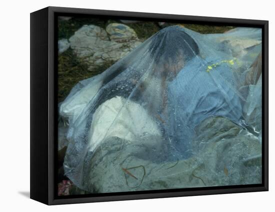 Youths Huddled under a Piece of Clear Plastic in the Rain, Woodstock Music and Art Fair-John Dominis-Framed Premier Image Canvas