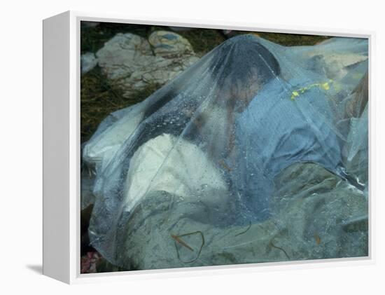 Youths Huddled under a Piece of Clear Plastic in the Rain, Woodstock Music and Art Fair-John Dominis-Framed Premier Image Canvas