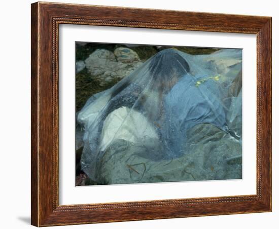 Youths Huddled under a Piece of Clear Plastic in the Rain, Woodstock Music and Art Fair-John Dominis-Framed Photographic Print