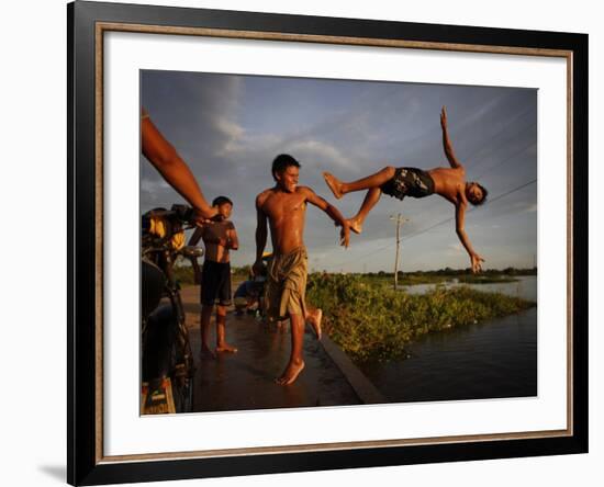 Youths Play in a Lagoon Near the Eastern Beni State Capital of Trinidad, Bolivia-null-Framed Photographic Print