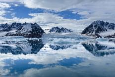 Antarctica, Antarctic Peninsula, Wilhelmina Bay with iceberg, glacial ice and snow petrel.-Yuri Choufour-Framed Photographic Print