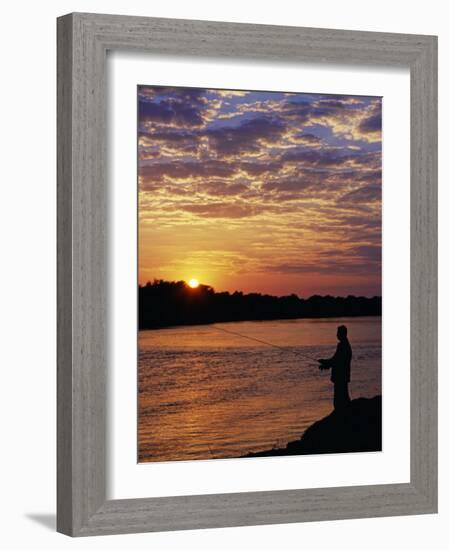 Zambezi National Park, Sausage Tree Camp, Fly-Fishing for Tiger Fish at Sunset on River, Zambia-John Warburton-lee-Framed Photographic Print