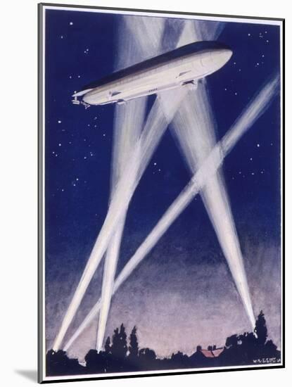 Zeppelin Raider is Caught in the Searchlights Over the Countryside-W.r. Stott-Mounted Photographic Print