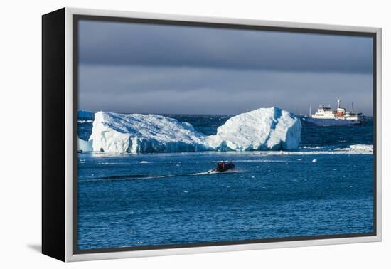 Zodiac cruising back to a cruise ship anchoring behind an iceberg, Brown Bluff, Antarctica, Polar R-Michael Runkel-Framed Premier Image Canvas